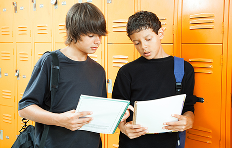 Teen Boys Comparing Homework