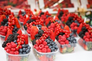 basket with fresh juicy berries on farmer market