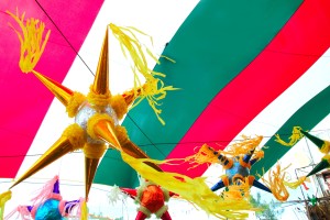 Mexican colorful pinata in mexico with flag background